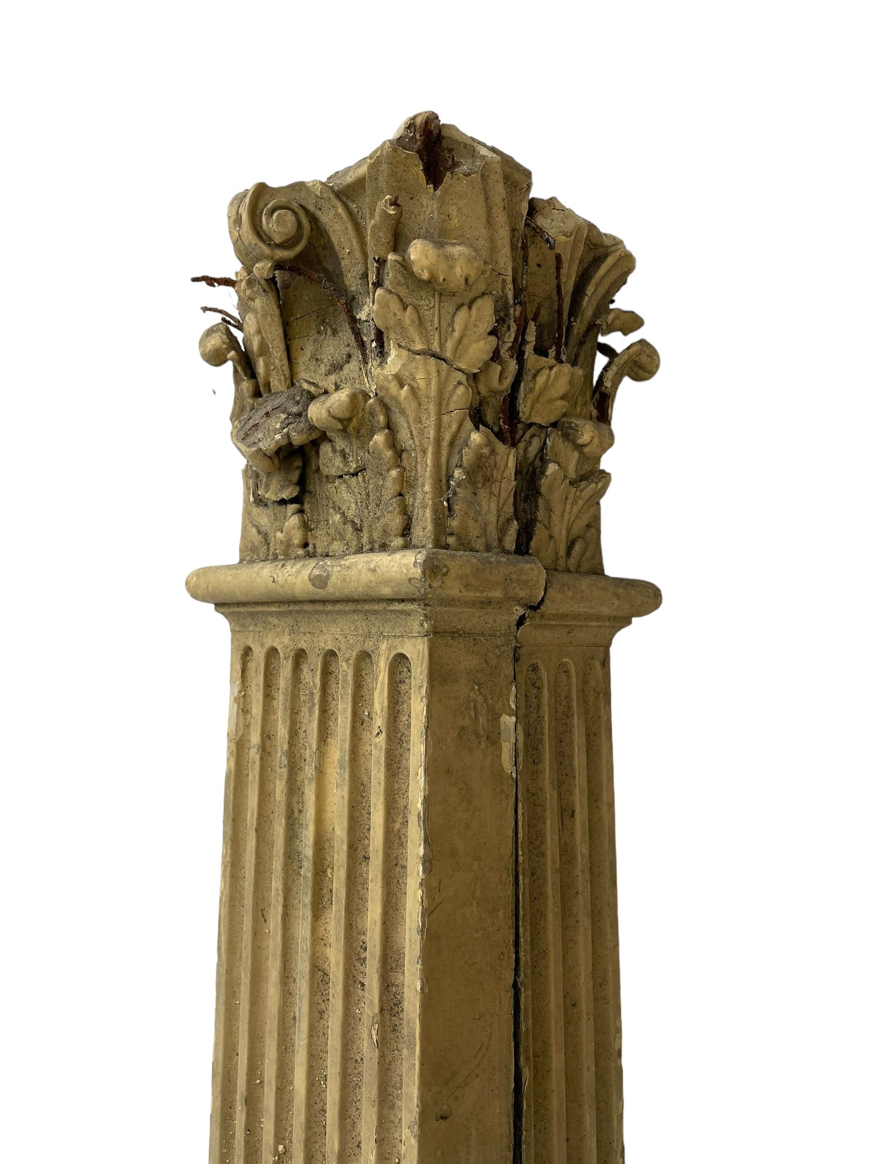 Three 19th century wood and gesso Composite order architectural architraves - curled acanthus leaf capitals over fluted shafts, the bases decorated with guilloche moulding over trailing laurel leaf branches, one half columns, one L-shaped rectangular pilaster and one full column, the largest - H204cm