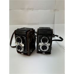 Two Yashica-635 Copal-MXV medium format TLR film cameras, circa 1970s, serial nos. ST 4041084 & SX 0031728, each with twin Yashikor 1:3.5 f-80mm lenses, in leather carry cases