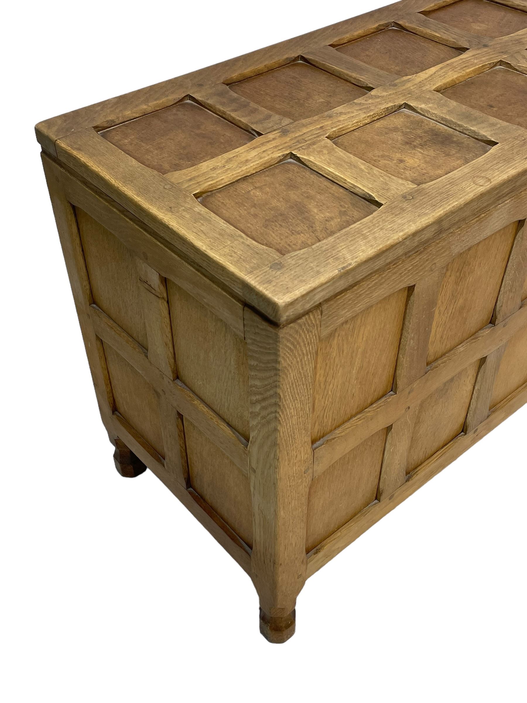 Sid Pollard (ex. Mouseman) - Yorkshire oak blanket chest, all over panelling, enclosed by hinged lid, on octagonal feet, interior plaque inscribed 'S. Pollard, Bagby, Thirsk, Yorks' 