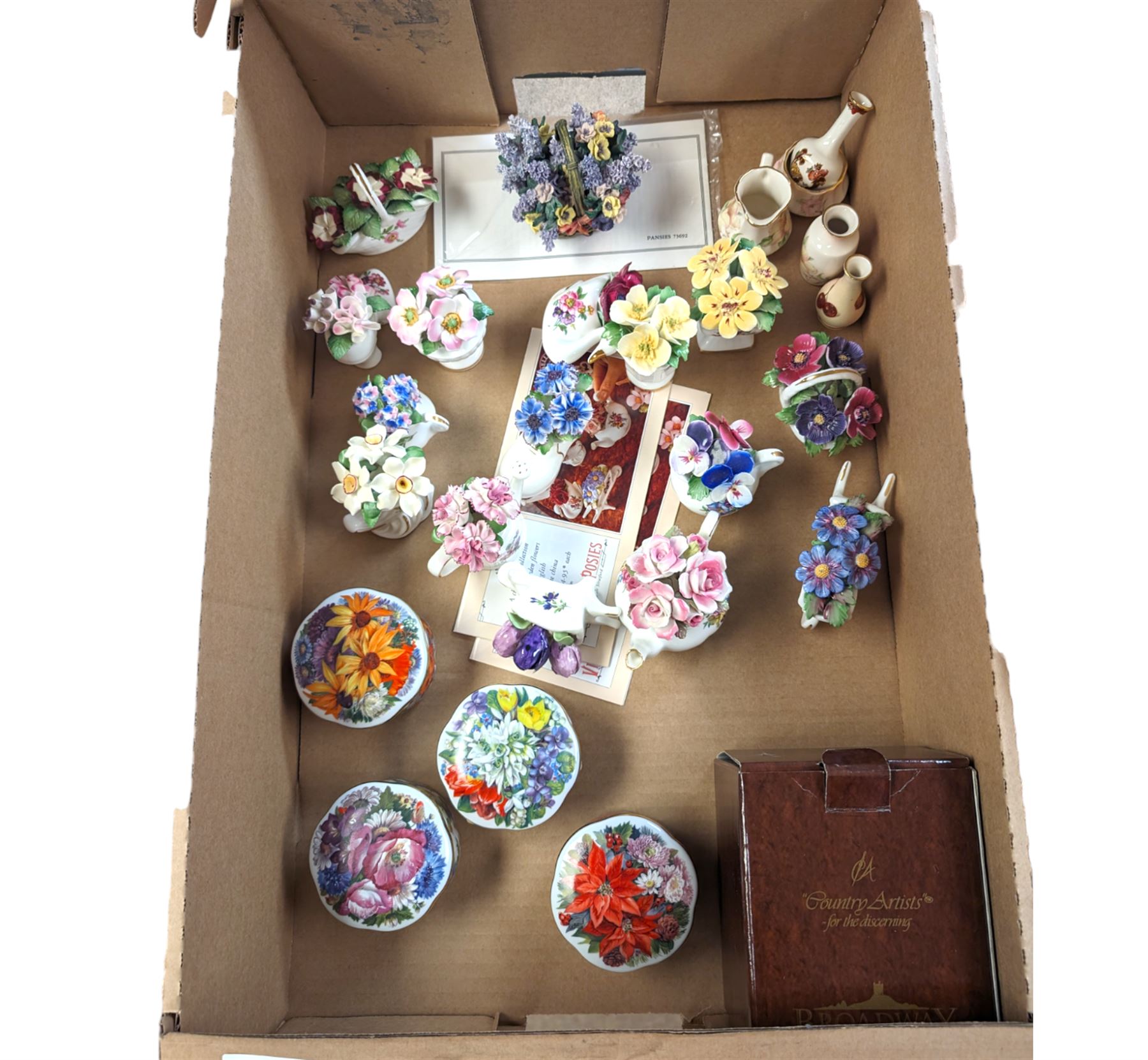 Four Ardleigh Elliott musical trinket boxes and one musical flower basket, four with boxes, together with ceramic flower baskets and posies, by various makers