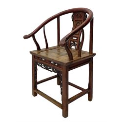 Late 19th century Chinese Qing dynasty horse shoe armchair, in elm, hung mu and Chinese softwood, horse shoe shaped upper rail carved with scroll terminals, shape back carved with solitary figure in robes, rectangular panelled seat in moulded frame, decorated with fretwork panels, on square supports united by stretchers 