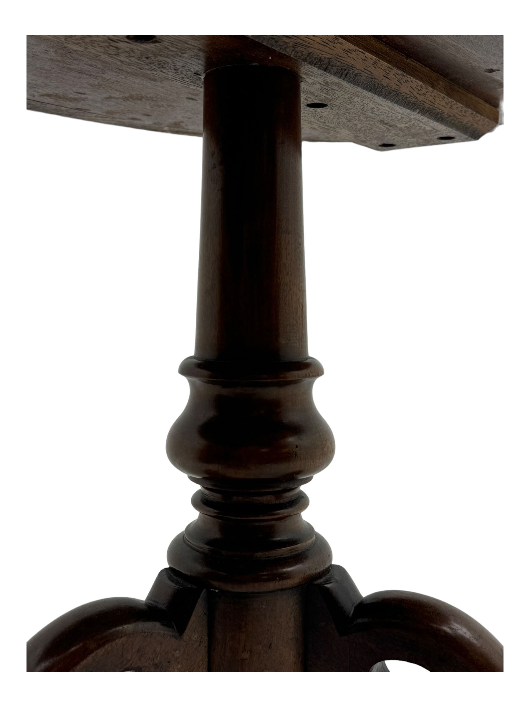 Victorian mahogany pedestal table, oval top inlaid with tapestry under glass, turned central pedestal with pointed finial, on three carved scroll supports