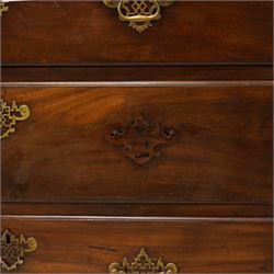 George III mahogany canted chest-on-chest, moulded cornice over three short and six long moulded drawers, shaped and pierced handle plates with swan neck handles, fluted upright canted corners, on bracket feet 