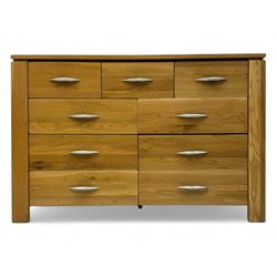 Contemporary light oak sideboard, rectangular top over three short and six long drawers ea...