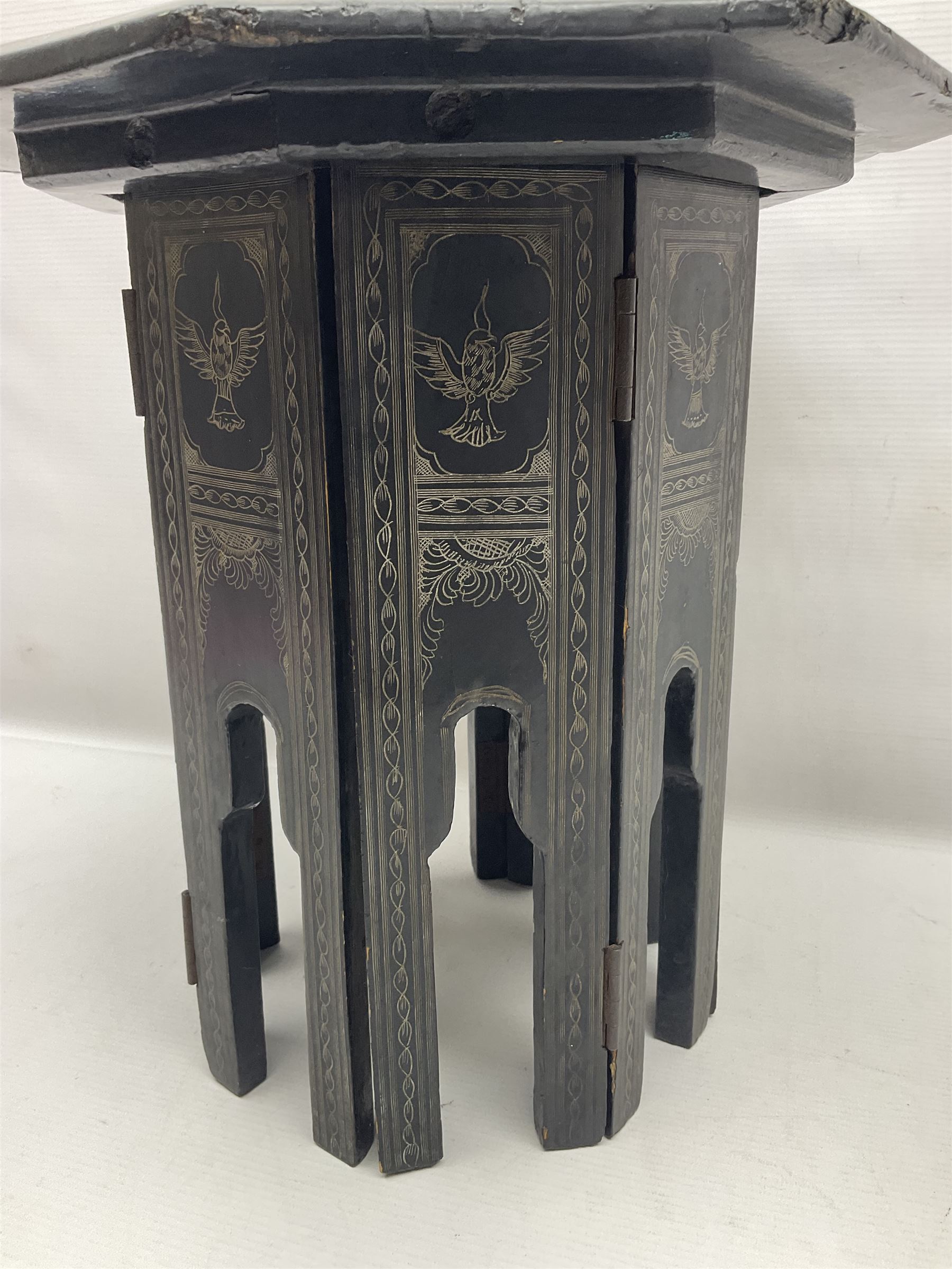 Anglo-Indian octagonal occasional table, with silvered inlay and a central panel depicting a temple scene, H36cm 