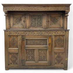 18th century oak court cupboard, projecting moulded cornice over carved frieze decorated w...