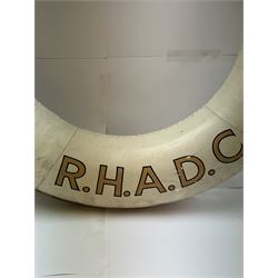 Four mid 20th century yacht lifebuoys, each painted in gold and black lettering 'Sarina R.H.A.D.C', upon a white ground, D68cm