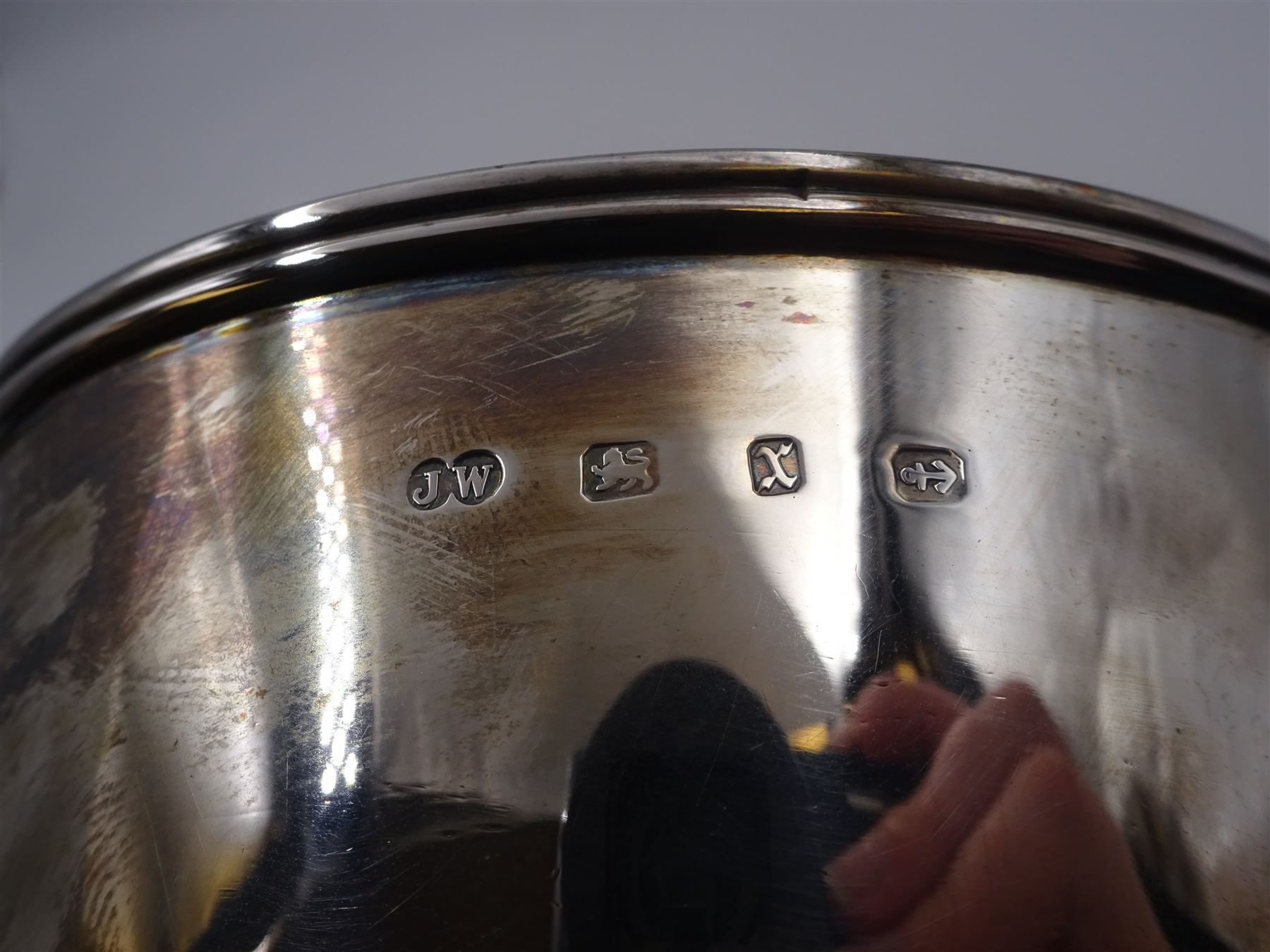 Late Victorian silver twin handled bowl, of plain circular form with two C scroll handles, upon a circular foot, hallmarked John Edward Wilmot, Birmingham 1897, including handles H8cm