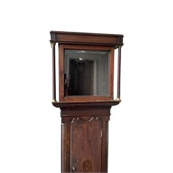 Empty oak longcase converted into a cupboard with shelves.