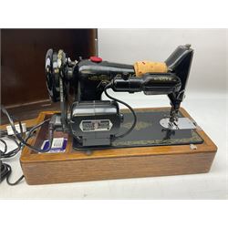 No.99 Singer sewing machine in case, with book, accessories, serial no EF 229971, 1949