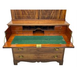 George III figured mahogany secretaire bookcase, projecting moulded dentil cornice decorated with single row of roundels, two figured mahogany doors with boxwood and ebony stringing enclosing three adjustable shelves and three drawers, moulded rectangular top over four long scratch-moulded drawers, the top secretaire drawer with fall front enclosing small drawers, pigeon holes and inset writing surface, shaped apron with bracket feet