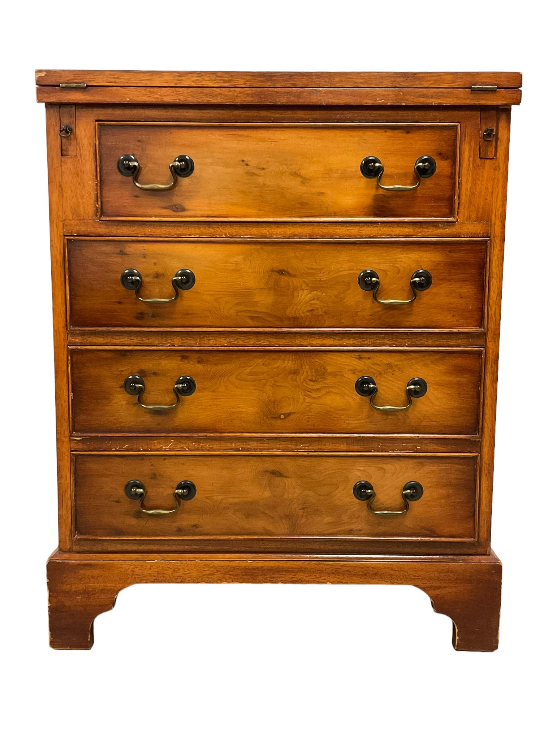 Georgian design yew wood bachelor's chest, fold-over rectangular top supported by pull-out stays, fitted with four long cock-beaded drawers, on bracket feet