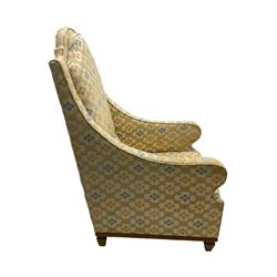 Spanish high back throne armchair, arched cresting rail over scooped arms, upholstered in gold and ivory patterned fabric, on a pitch pine base with spade feet