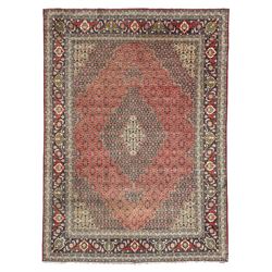 Perisian Bidjar crimson ground rug, within scalloped borders, central pole medallion, the field decorated all over with floral Herati motifs, guarded border decorated with repeating stylised plant motifs and trailing branch 