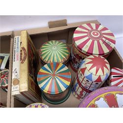 Collection of circus and fairground collectables, to include teapots, biscuit tins, including musical examples, and four Circus/fair themed books, including two library first editions