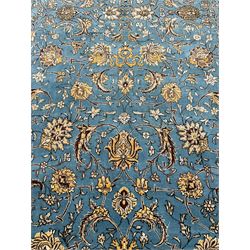 Persian Nain blue ground rug, overall arabesque design, the busy field decorated with interlacing branches and palmettes, indigo ground border with panels decorated with knots and lotus flower motifs, surrounded by trailing branches and flower heads, within guard stripes