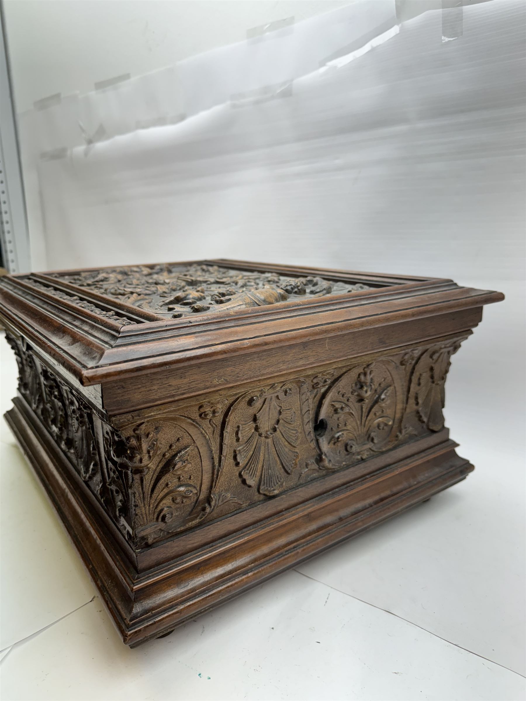 19th century Continental mahogany and oak box, carved in high relief with classical figures, harp, musical trophies, anthemion and foliate motifs, H22.5cm L48cm D38.5cm