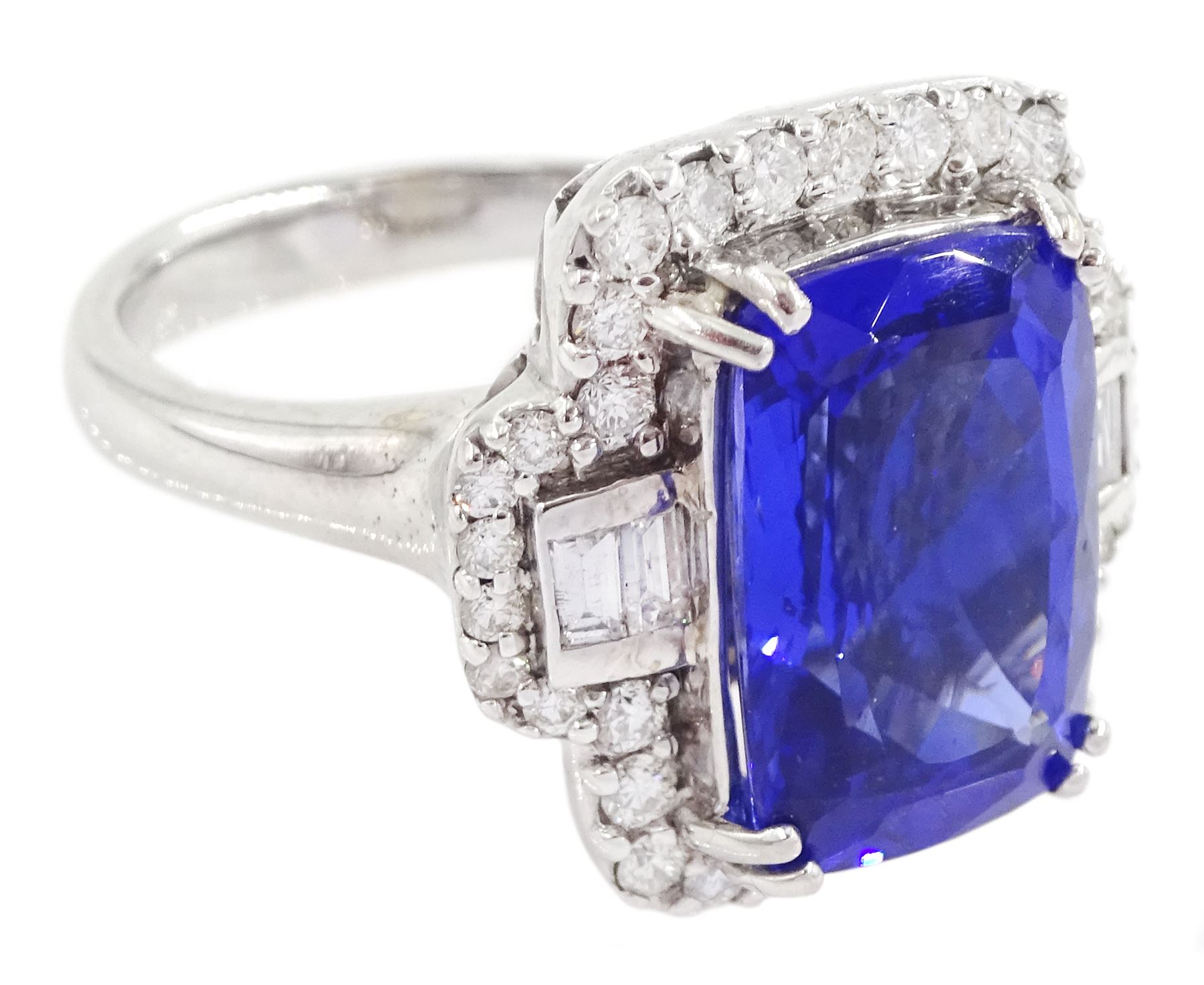 18ct white gold tanzanite, baguette and round brilliant cut diamond cluster ring, stamped 750, tanzanite approx 6.15 carat, total diamond weight approx 0.65 carat