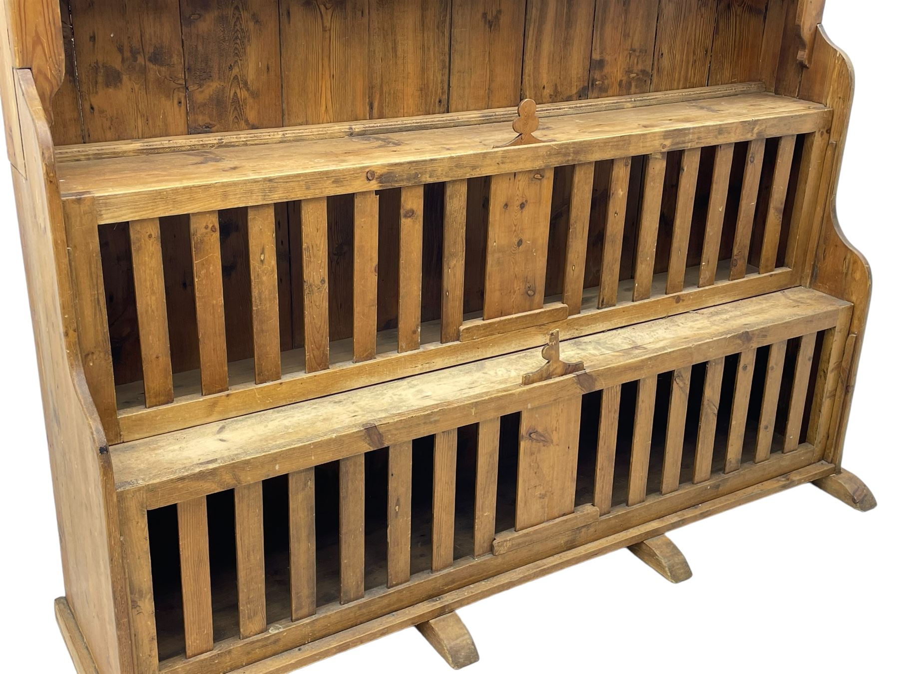 Waxed pine 'chicken coop' or 'hutch' dresser, projecting cornice over shaped frieze and three tier plate rack, the stepped waterfall lower section fitted with two slatted chicken coops, on sledge feet 