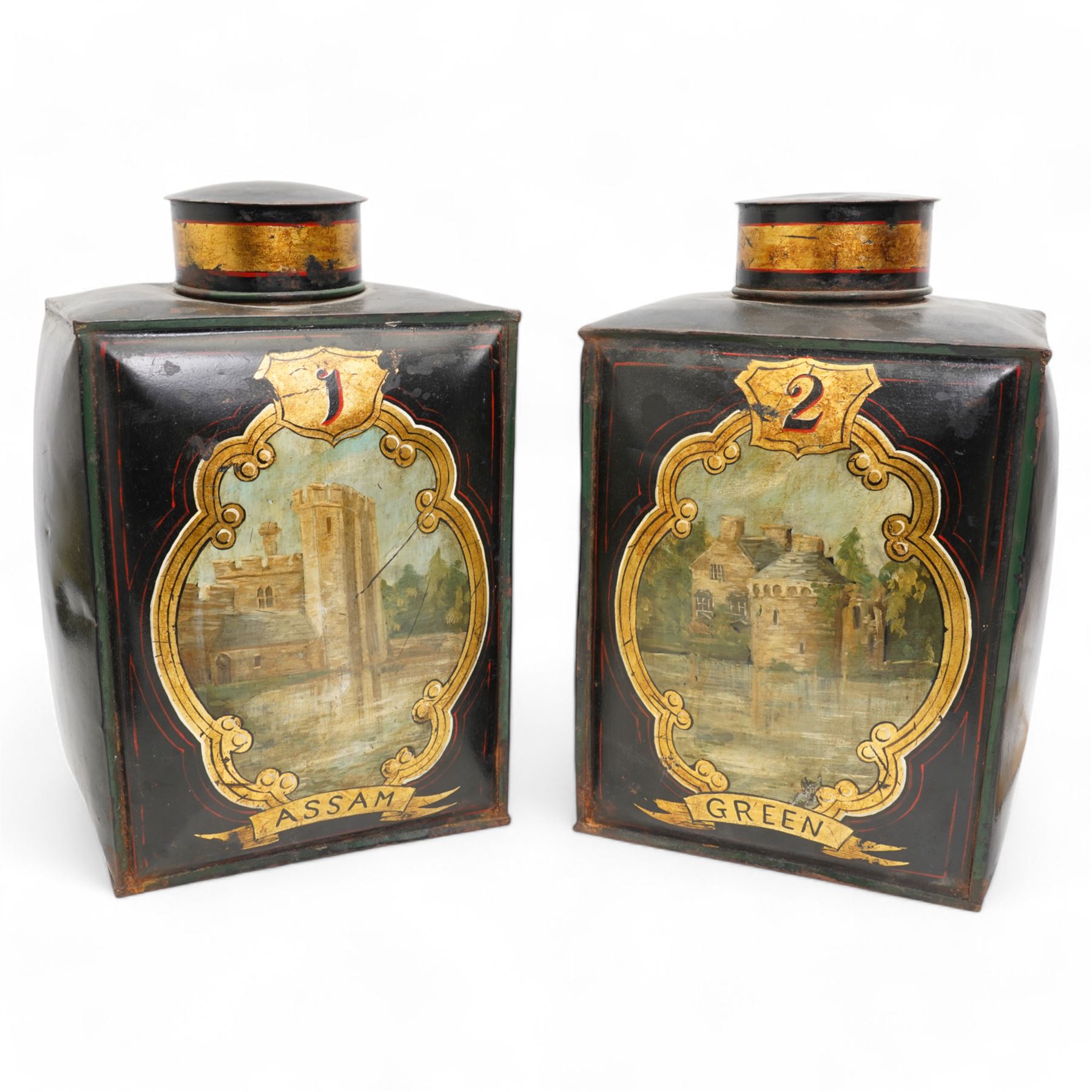 Pair of Victorian toleware shop display tea canisters and covers, numbered 1 & 2 and labelled 'Assam' and 'Green', each of rectangular section, painted with a castle and fort, within a gilt cartouche on black ground, H42cm 