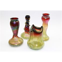 Four Austrian Art Nouveau vases, including a Rindskopf Pepita vase, the tapering iridescent green and red body with three pinched points, and another Rindskopf example with applied snake decoration, tallest H23cm (4)