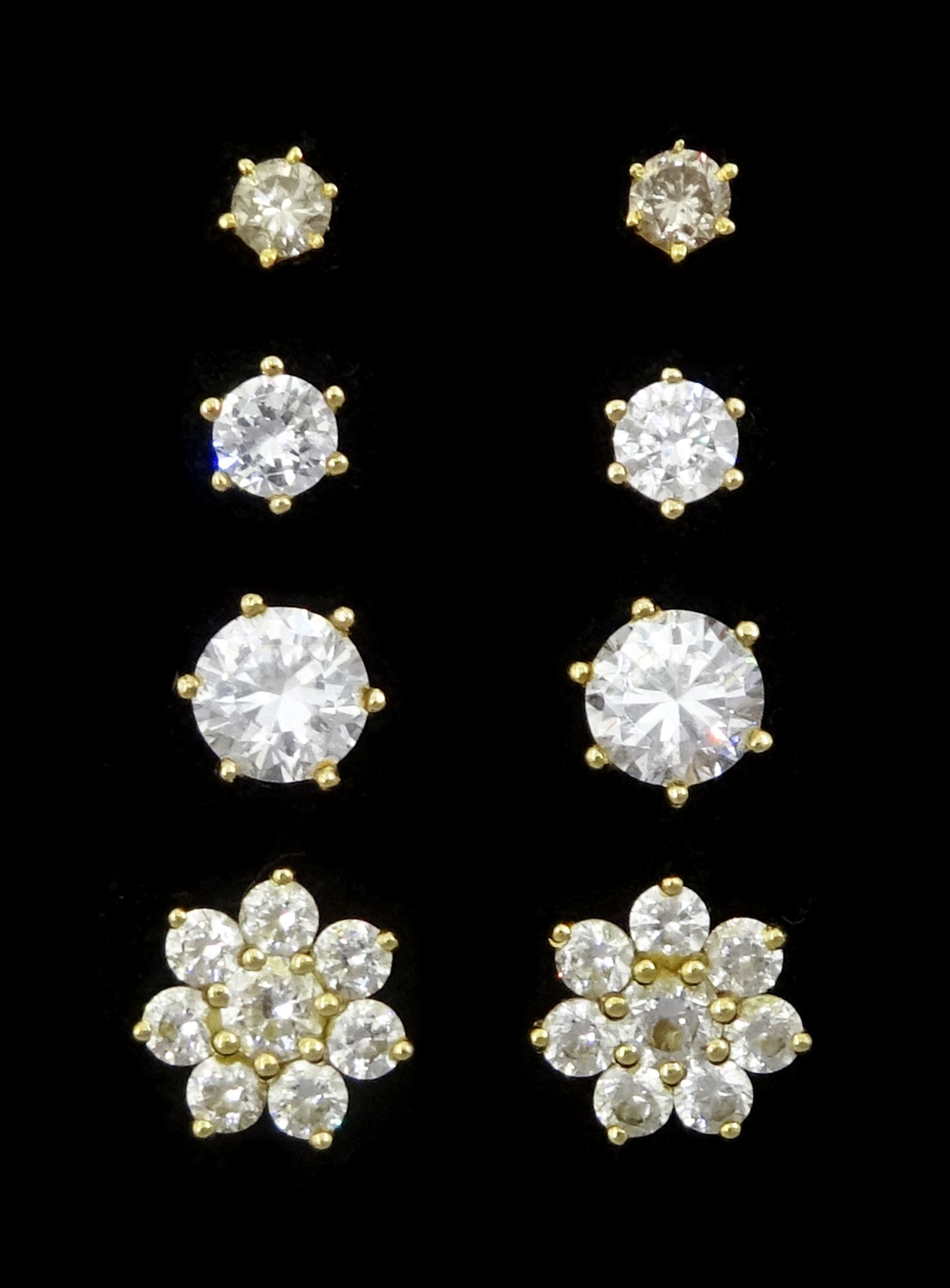 Pair of 18ct gold round brilliant cut diamond stud earrings and the pairs of 9ct gold cubic zirconia stud earrings