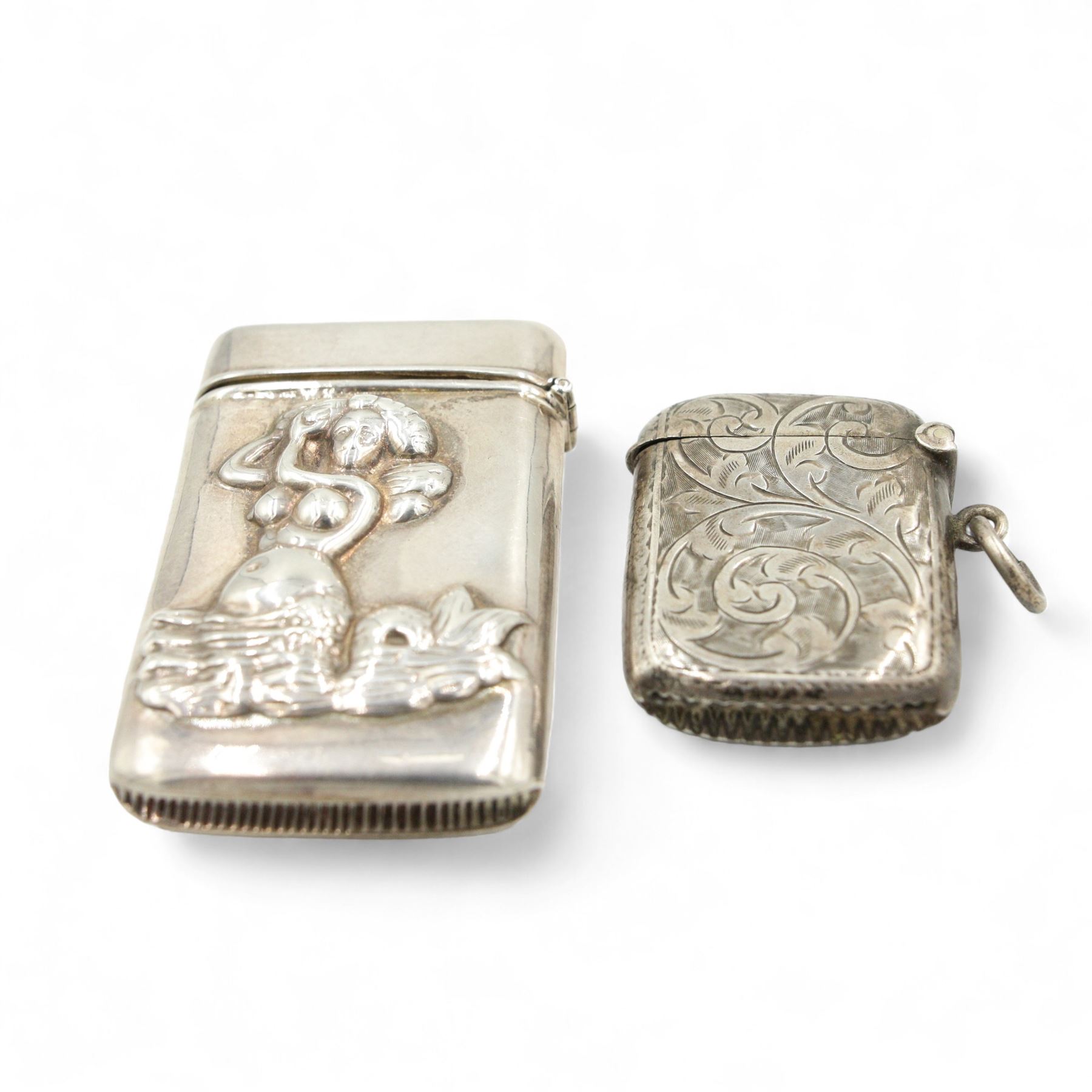 Silver vesta case with female figure decoration, engraved silver vesta case, two silver match box holders three silver pipe tampers, silver spike and silver sealing wax holder