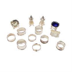 Group of silver, comprising four piece cruet set and nine napkin rings, one stone set exam...