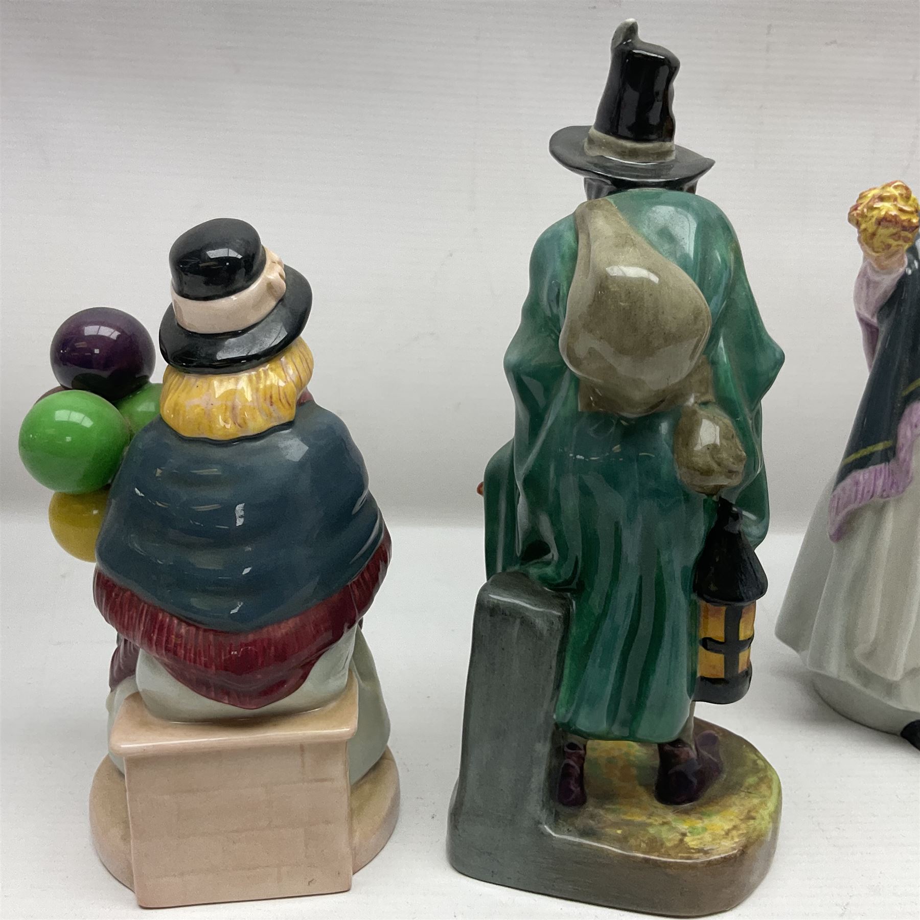 Seven Royal Doulton figures, including The Mask Seller HN2103, Silks and Ribbons HN2017, Balloon Girl HN2818, Balloon Boy HN2934 and other balloon sellers 