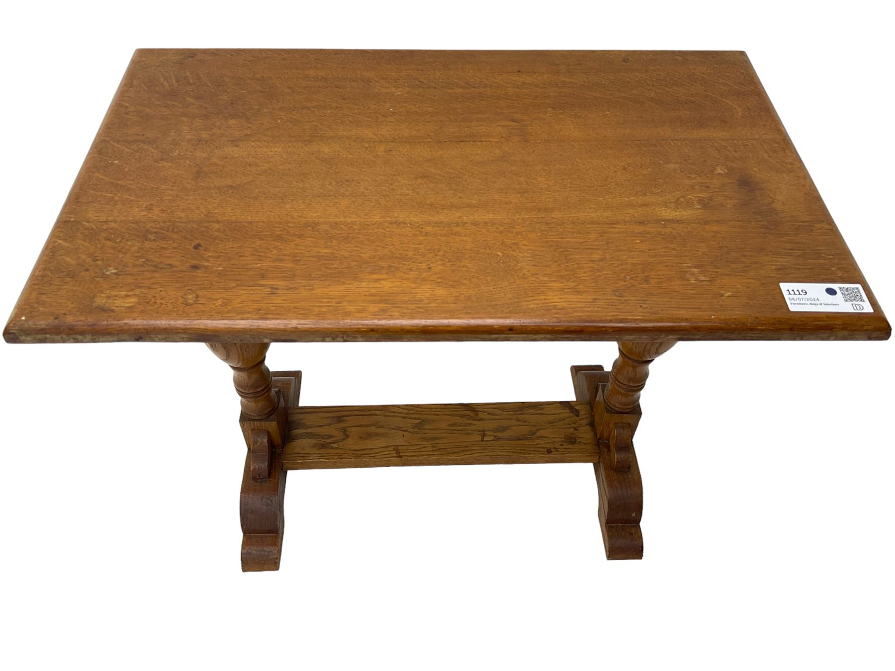 20th century oak occasional table, rectangular top on turned twin pillar supports, carved with squirrel motif, on shaped sledge feet united by stretcher 