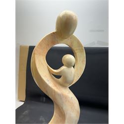 Abstract marble sculpture modelled as a mother and child on a rectangular base, H62cm