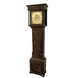 8-day - profusely carved oak longcase, with a flat top and square hood door beneath, door flanked by barley twist columns with brass capitals, trunk with reeded quarter columns and wavy topped door, on a carved plinth raised on bracket feet, brass dial with an engraved and matted dial centre, penny moon and date aperture, chapter ring inscribed “John Stancliffe” with Roman numerals and five-minute Arabic's, rack striking movement with a recoil anchor escapement. With pendulum and weights.