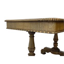 Early 19th century Regency rosewood writing table, rectangular top with inset leather writing surface and gadroon moulded edge, fitted with single frieze drawer, on twin turned pillar supports with lobe carved balusters, on platforms with beaded edge, acanthus scroll carved feet