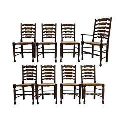 Matched set of eight (7+1) oak ladder back dining chairs, waved ladder back over rush seats, on turned supports joined by turned stretchers