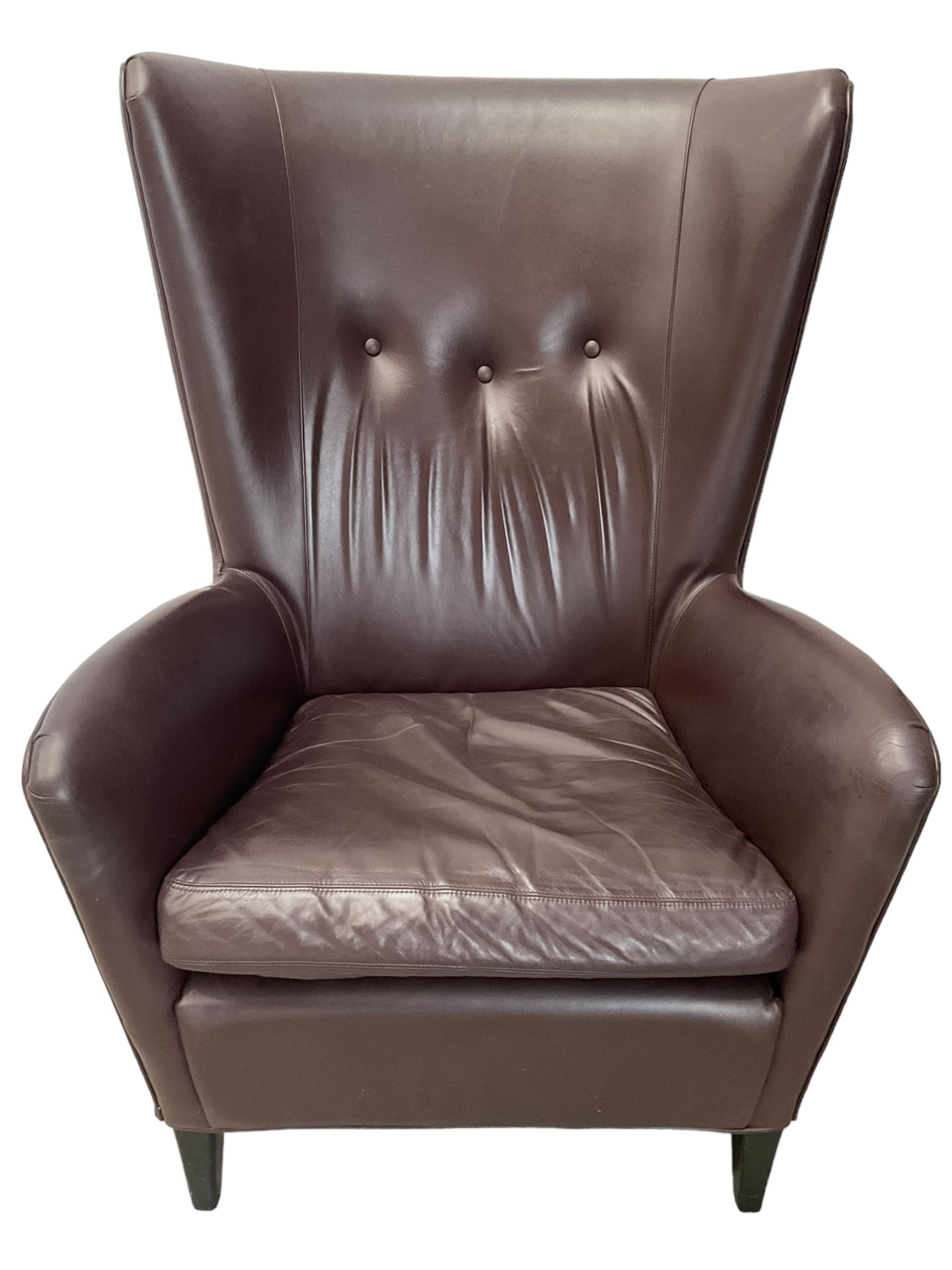 Wing back armchair upholstered in cocoa brown leather