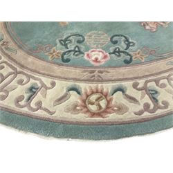 Chinese pale turquoise ground washed woolen rug, oval form decorated with bouquets of floral designs and Chinese characters, enclosed by a wide guard band