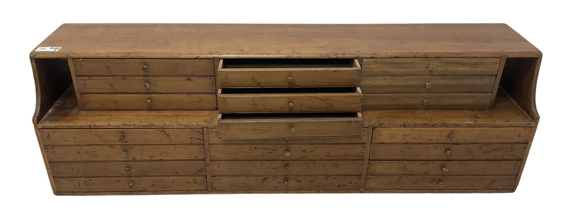 Late 19th century stained beech Solicitor's desktop bank of correspondence drawers, two-tiered, fitted with twenty one drawers, together with related brass plaques