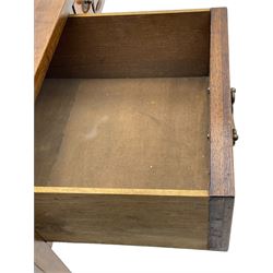 Mid-to-late 20th century mahogany writing desk, the rectangular top with a tooled red leather insert bordered with gilt detailing, three cock-beaded drawers with brass handles, the narrow central drawer flanked by two wider drawers, standing on square tapered legs