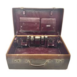 Early 20th century leather bound travelling case, with initials to cover, with fitted interior containing five silver topped glass jars, each engraved with initials, hallmarked The Alexander Clark Manufacturing Co, London 1910 & 1911, case W61cm