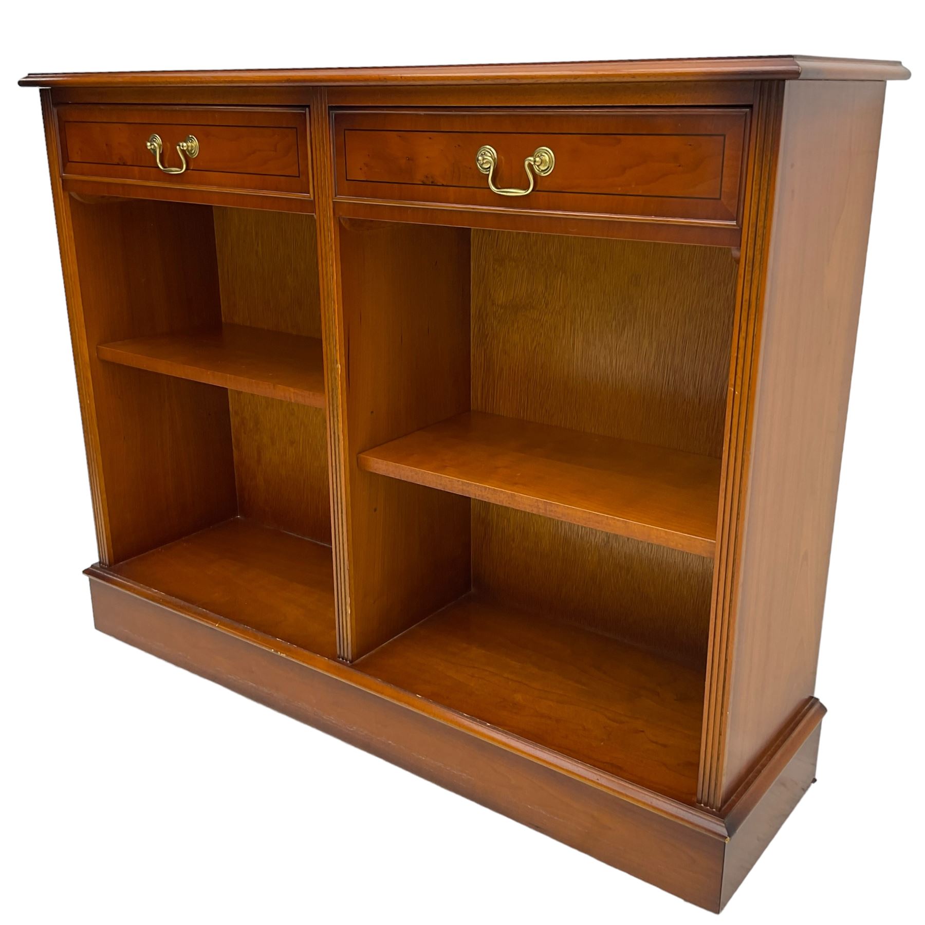 Georgian design yew wood open bookcase, rectangular moulded top over two drawers and two adjustable shelves, on moulded plinth base 