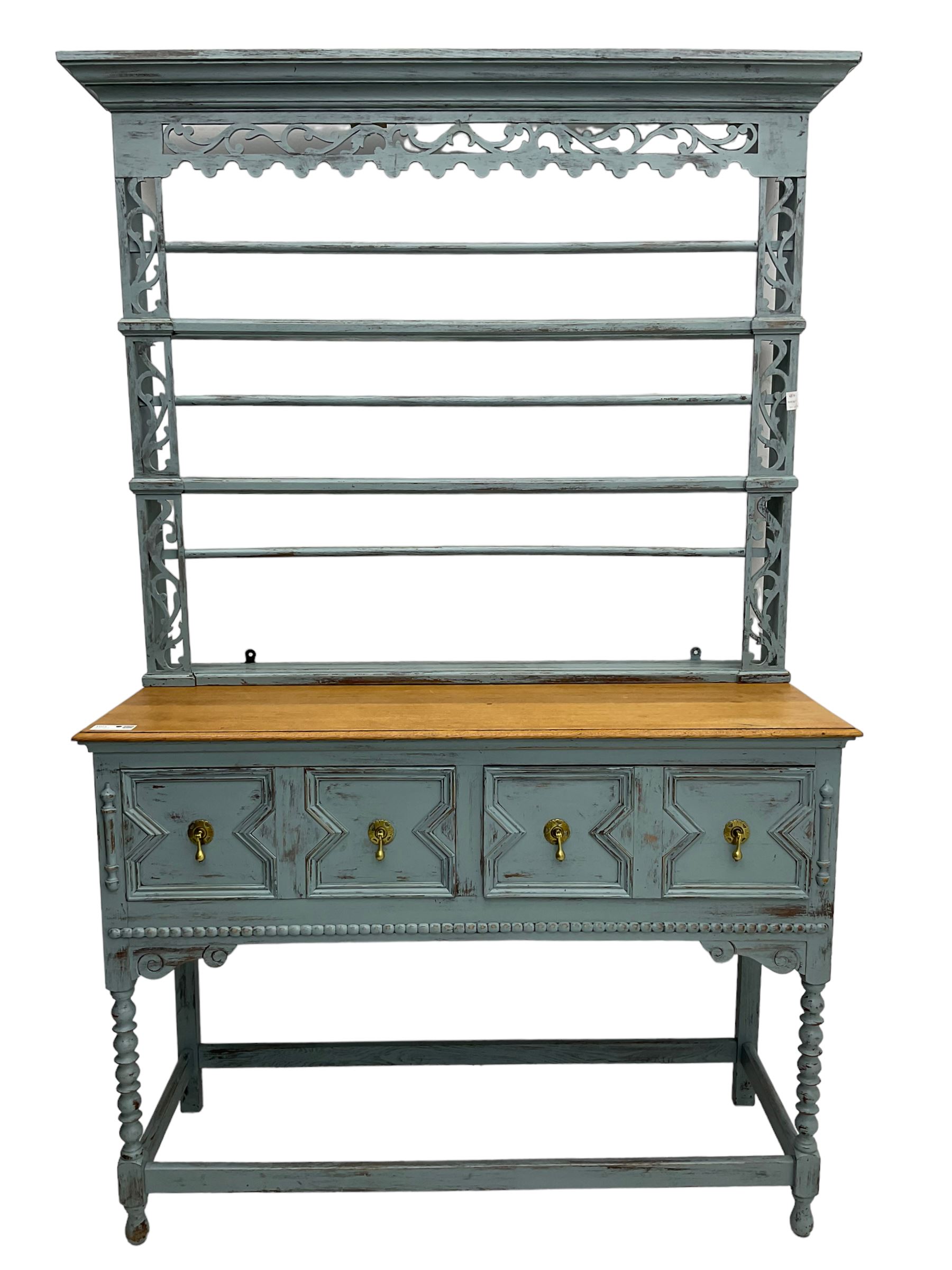 20th century painted oak dresser, projecting moulding cornice over pierced frieze and upright, moulded rectangular top over two drawers with geometric mouldings, on turned supports united by stretchers 