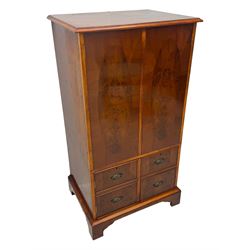 Wade - yew wood hi-fi cabinet, moulded rectangular hinged top over double-door cupboard with figured veneer, enclosing three adjustable shelves, lower section fitted with two cupboards to resemble four drawers, enclosing three drawers and open storage