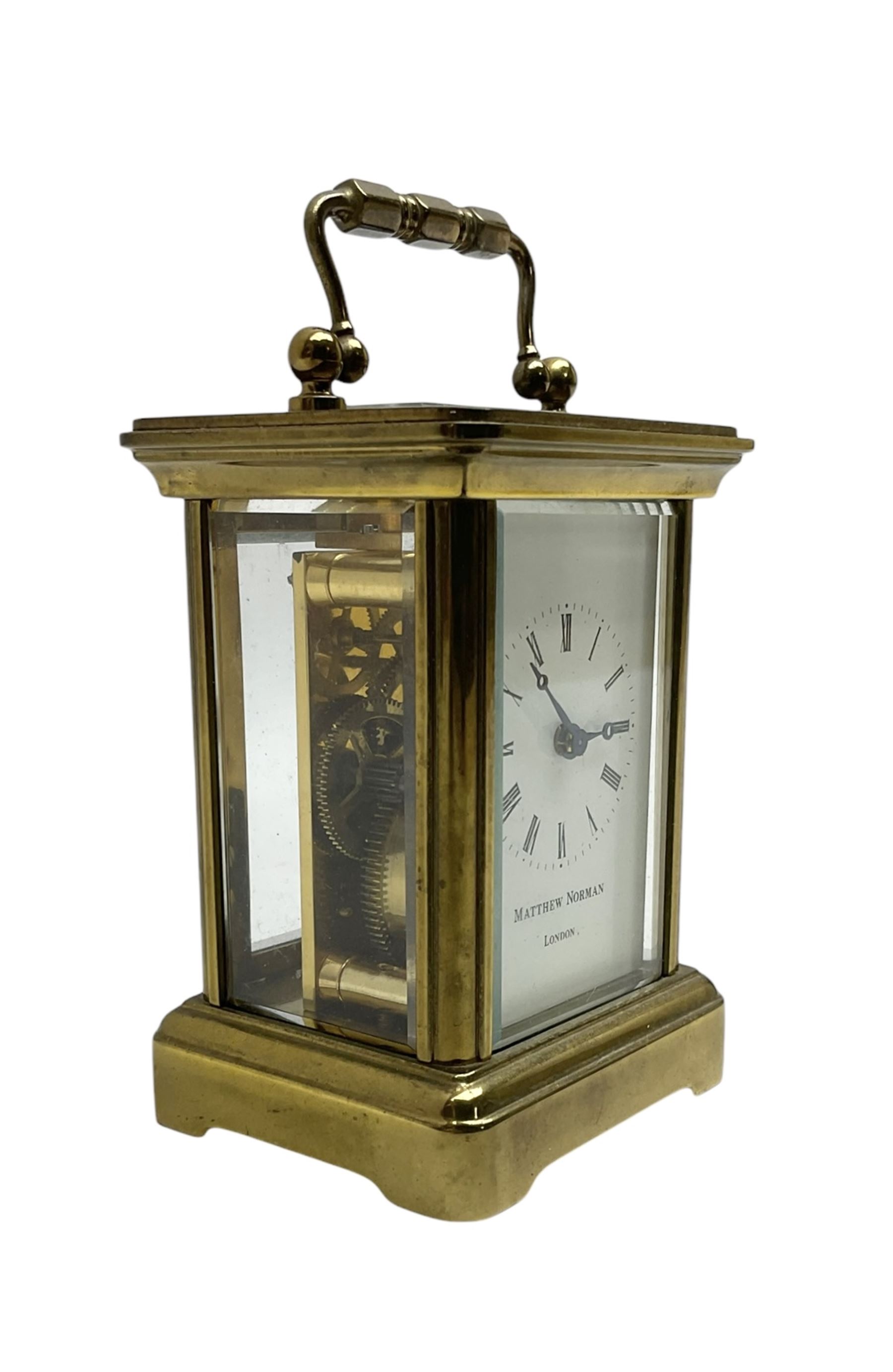 Matthew Norman - miniature 20th century brass carriage clock, 8-day timepiece movement in a corniche case with an enamel dial, Roman numerals and moon steel hands, with a jewelled lever platform escapement. With key.