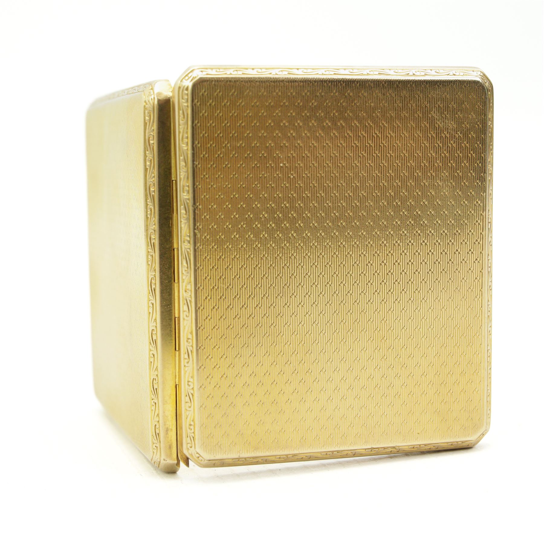 Early 20th century 9ct gold case, with engine turned decoration and sliding hinge mechanism by Alexander Clark & Co Ltd, Birmingham 1927, L6cm