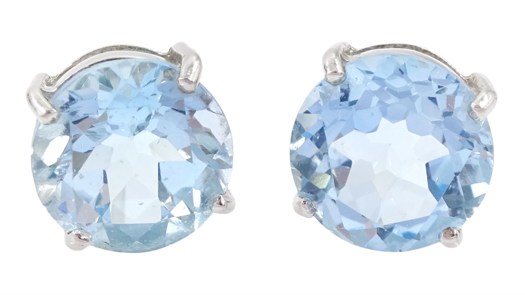 Pair of 9ct white gold round cut sky topaz stud earrings, hallmarked