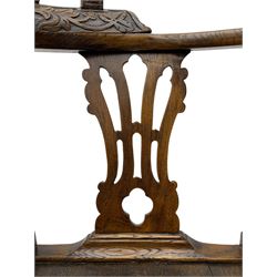 Elm 'Windsor' splat back corner armchair, shaped cresting rail carved with leaves over shaped and pierced splat, the curved arms carved with foliage and scrolled terminals, turned upper supports and a further two splats, panelled seat within foliate carved seat rails, on square rear supports with front shell carved cabriole support, united by plain x-frame stretchers