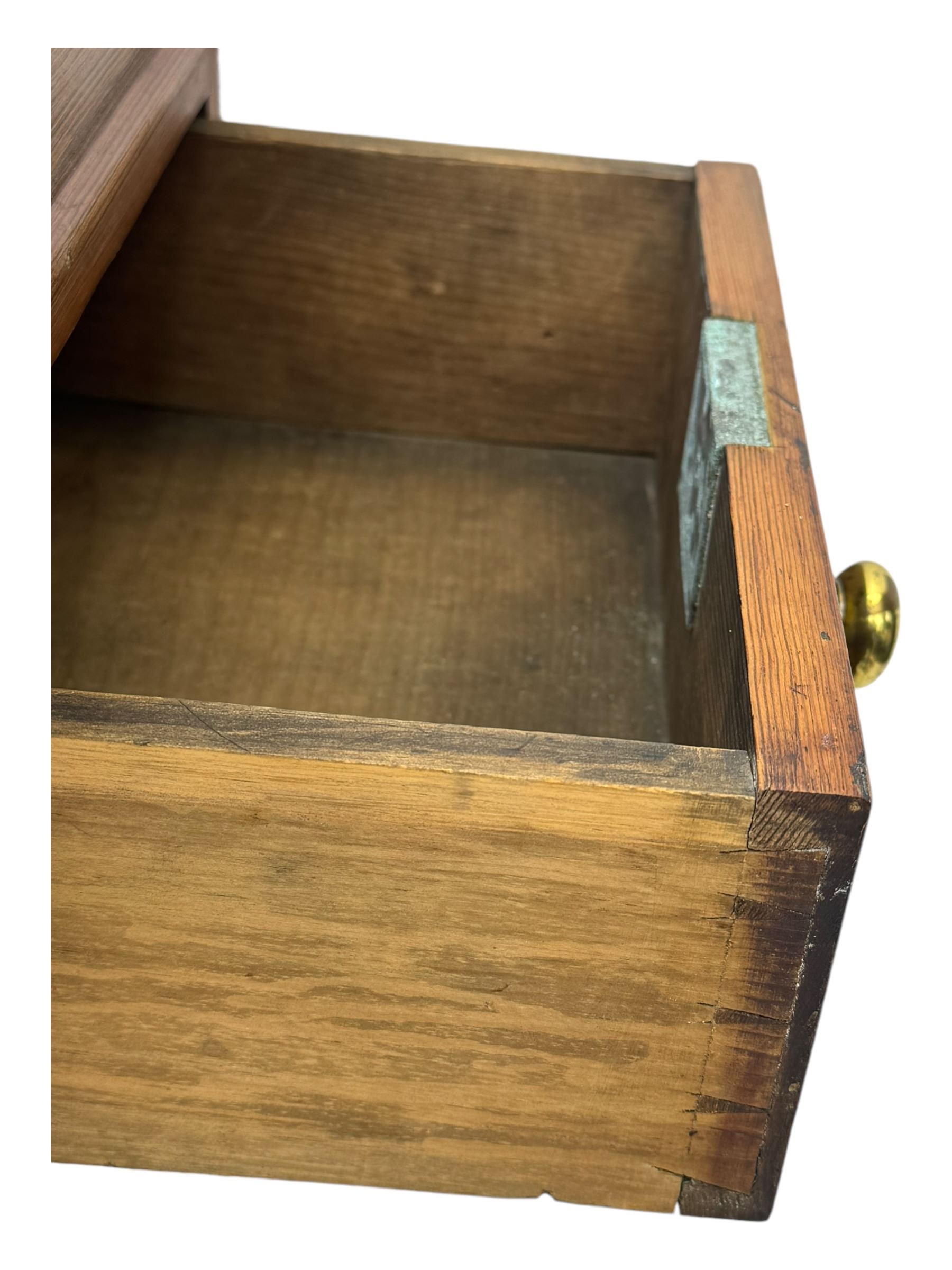 19th century pitch pine Davenport desk, sloping hinged top, fitted with four drawers, on turned column supports, turned compressed feet with castors 