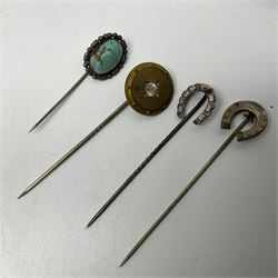 Ten Victorian and later hatpins, to include horseshoe examples, glass beads etc, together with two pin cushions 