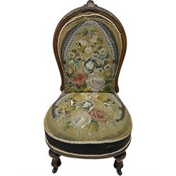 Early 20th century mahogany side chair, detailed marquetry frame, backrest with central urn motif and scrollwork inlay, arched crest rail with floral designs, cream and gold patterned fabric seat, turned front legs with brass castors (H78cm); Victorian walnut nursing chair, carved crest rail, floral needlepoint tapestry upholstery, turned front legs with ceramic castors (H81cm)