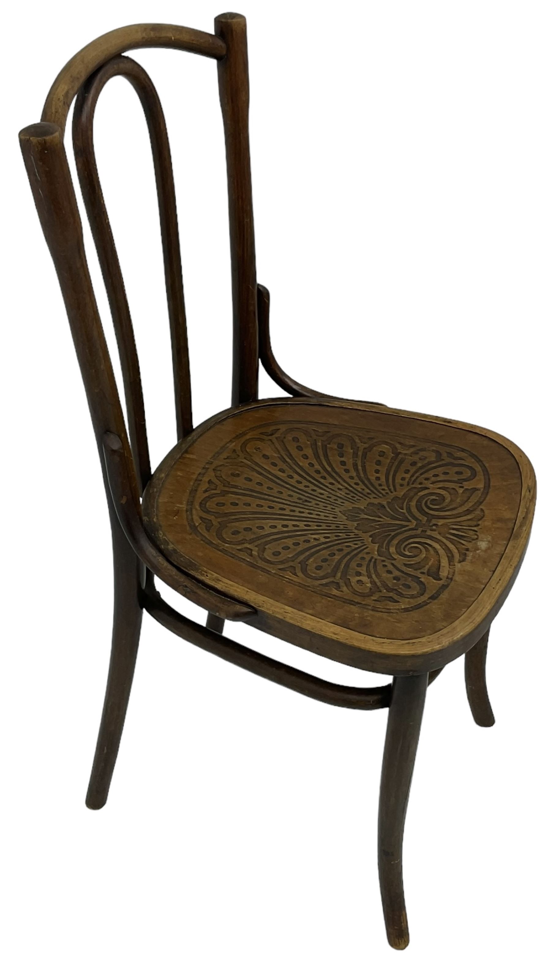 Set of three late 19th to early 20th century century bentwood dining chairs, the seats with pressed anthemion decoration, circa. 1900s